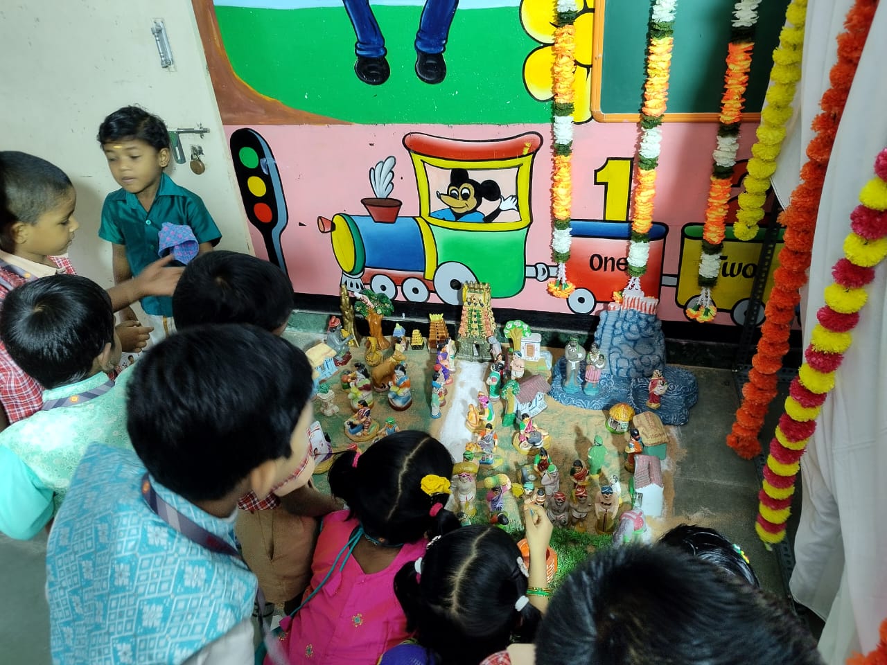 Children enjoying the Golu doll display during navrathri.