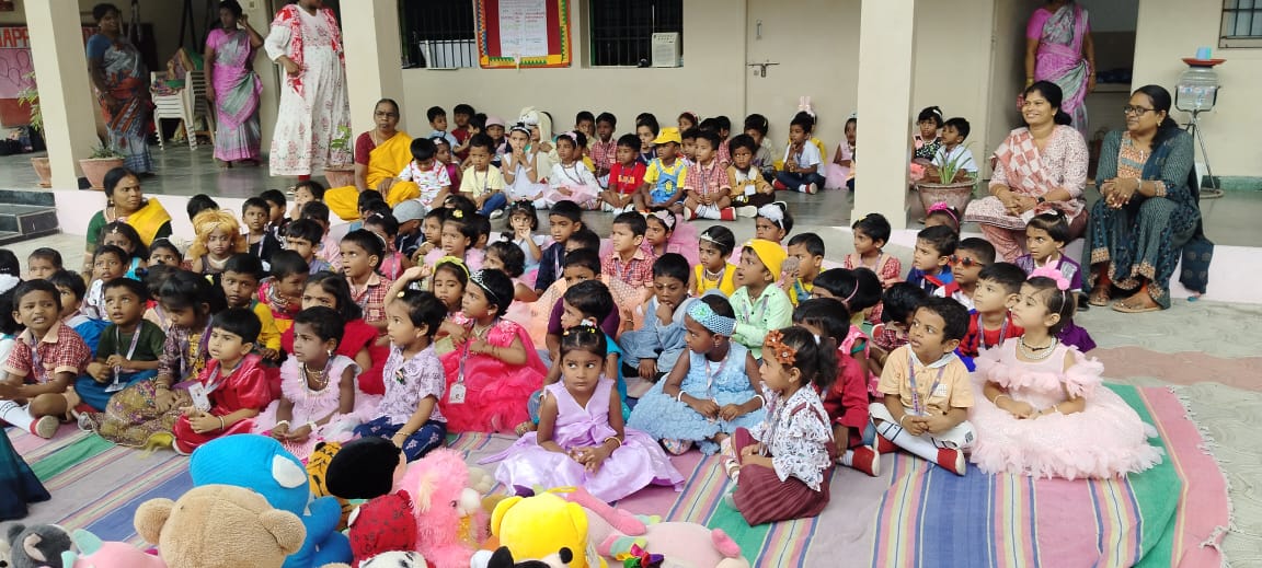 Children’s eyes shine with excitement as they listen to tales.