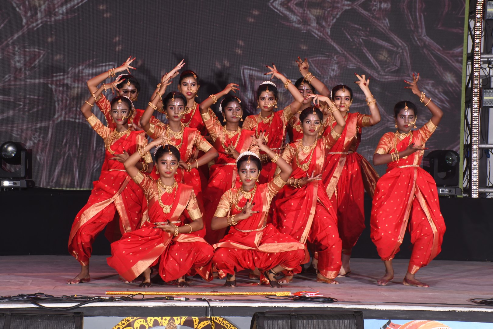 Fire performance by glittering girls for the aigiri Nandini dance.