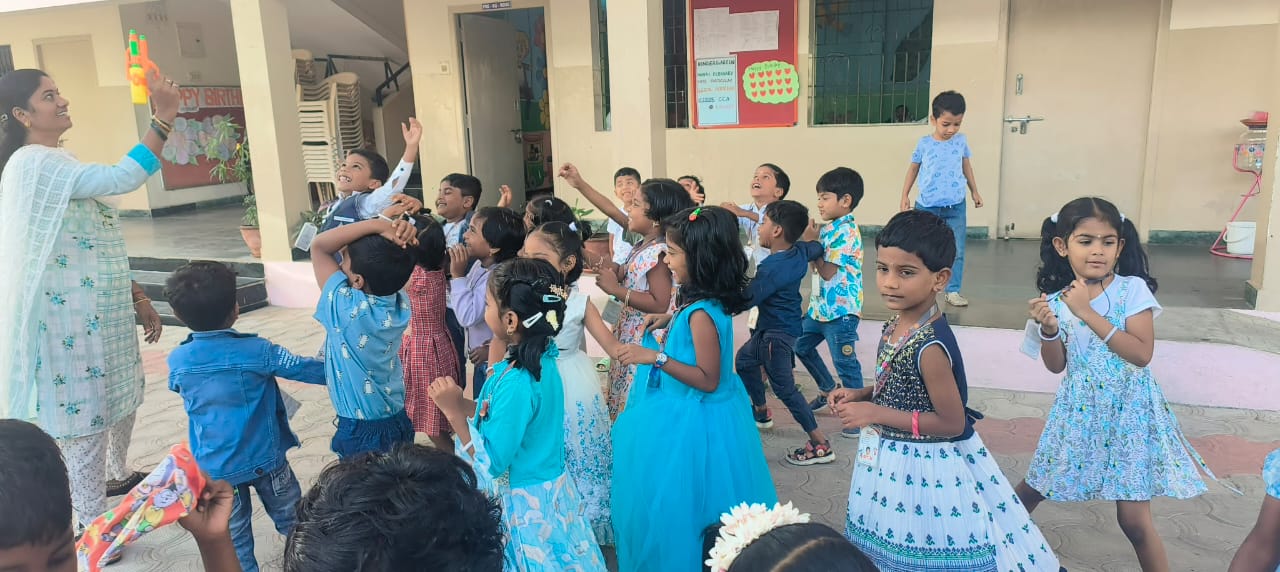 Joyful moments as the teacher and kids share bubble fun!