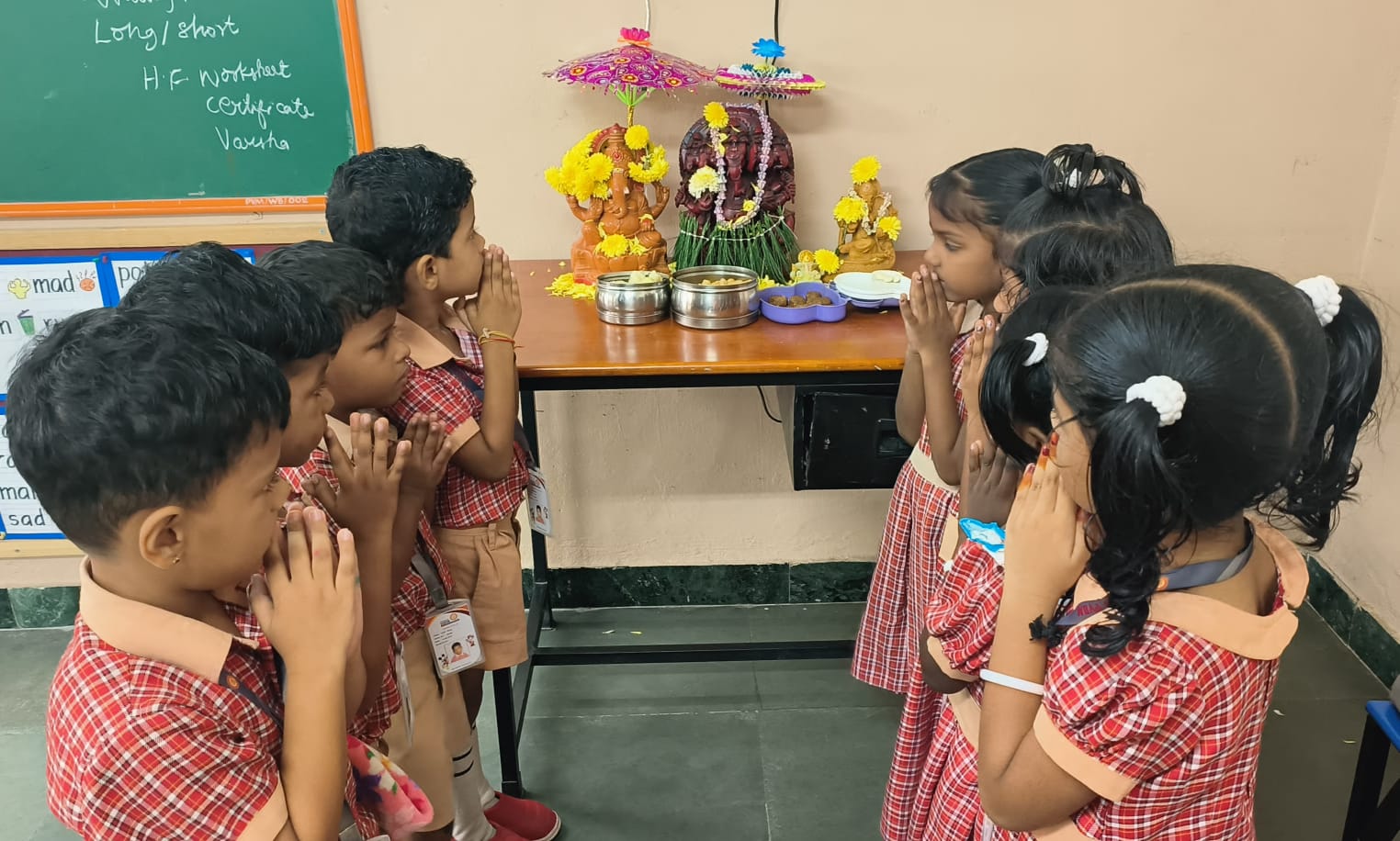 Surrounded by the vibrant colors of celebration, the children seek Lord Ganesha’s blessings with pure heart, strength, and endless joy in their lives. (2) (1)